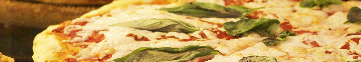 Eating Italian Pizza at Primo Pizza & Pasta restaurant in Carlsbad, CA.